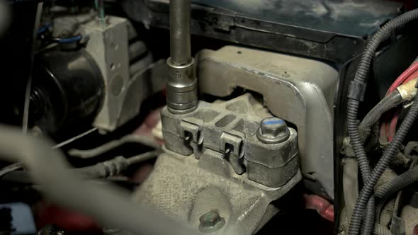 Close Up Screwing Tightly Car Engine Bolts alt