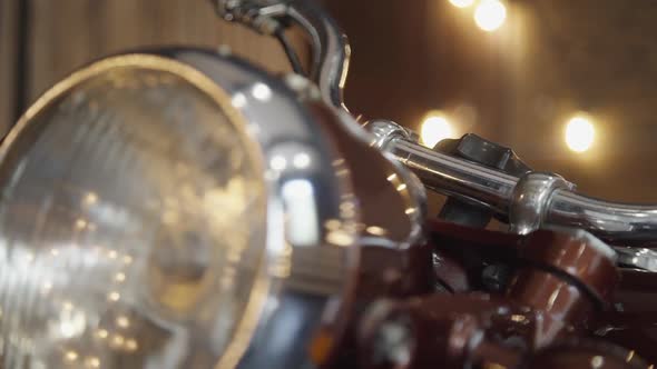 Closeup View of Retro Motorbike Standing in Interior for Wedding Event