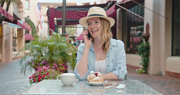 Beautiful Traveler Enjoying Coffee at Bakery on Street of Old European Town,  alt