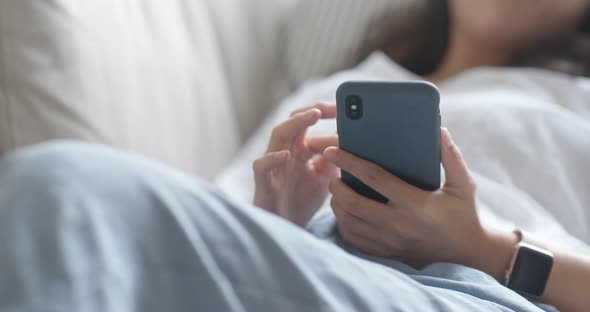 Young woman use of smart phone at home alt