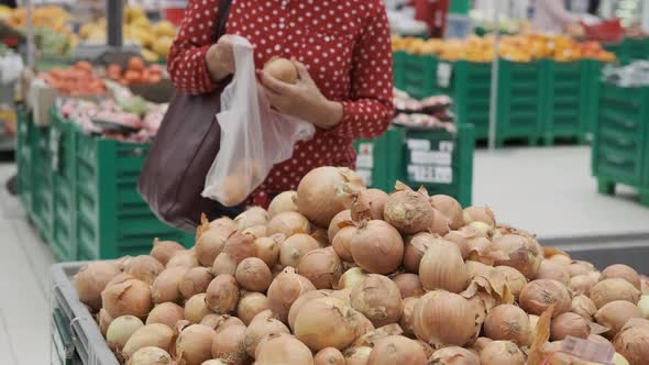 Senior Woman Choosing Onions in a Grocery, Stock Footage | VideoHive