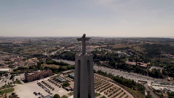 Sanctuary of Christ the King erected on clifftop overlooking the Tagus River and Lisbon cityscape alt