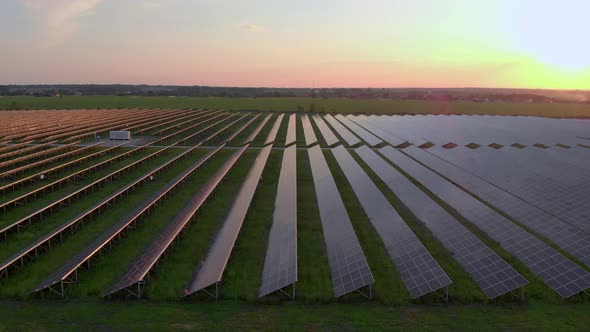Drone Fly Over Solar Farm. Renewable Green Energy and Electrical Technology. Field of Solar Panels alt