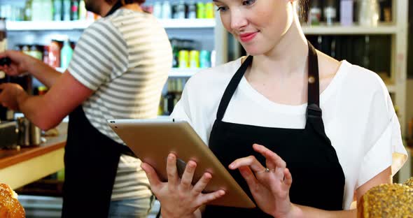 Waitress using digital tablet alt