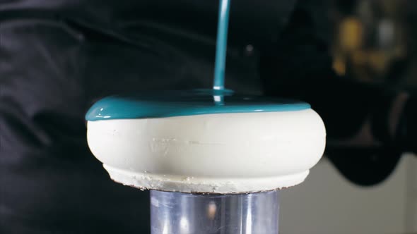 Closeup of a Pouring a Syrup Glazing Over Cake