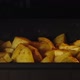 TIME-LAPSE: Close shot of cooking fried potatoes in the oven - VideoHive Item for Sale
