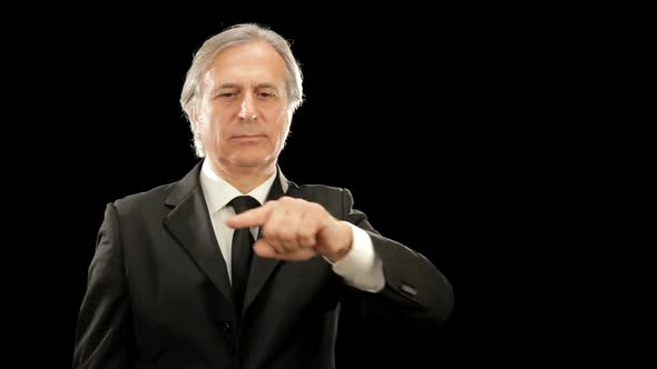 Middle Age Elegant Businessman Gesturing Isolated on Black alt
