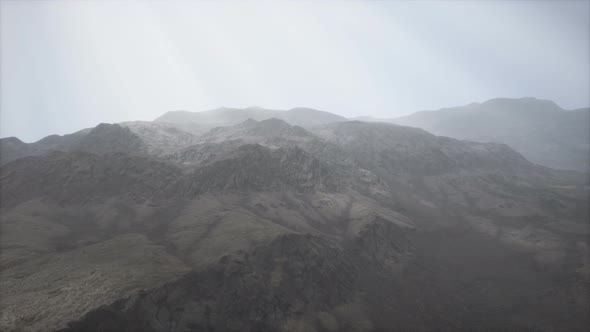 Sun Rays Against the Backdrop of the Mountains alt