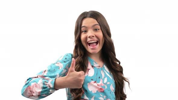 Approval Thumb Up Gesture of Child with Amazed Happy Face and Curly Hair Isolated on White Approve alt