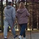 Rear view of caucasian senior couple nordic walking in the park. Shot with RED helium camera in 4K - VideoHive Item for Sale