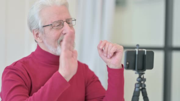 Old Man Recording Video on Smartphone Blogging alt