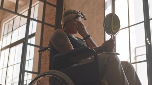 Woman with Disability Doing Makeup alt