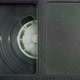 The Left Side of the VHS Cassette. a Film Reel Spins in a Small Cassette Window - VideoHive Item for Sale
