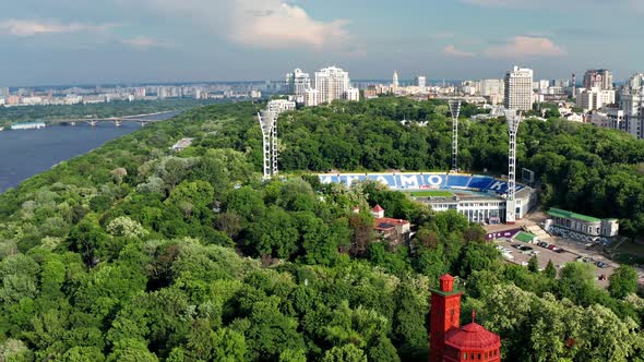 Beautiful flight from above over the capital of Ukraine Kiev. Top view of the football stadium. alt
