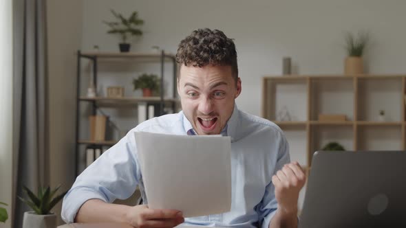 Attractive Young Guy Read Good News in Document alt
