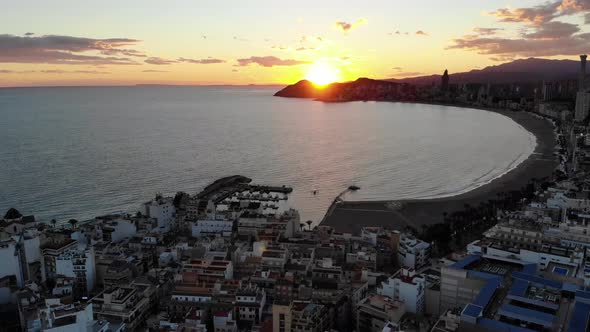 Sunset Night time Aerial footage of Benidorm showing the beaches