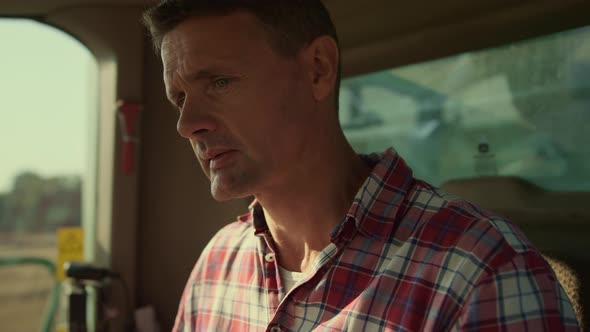 Tractor Driver Checking Cabin Before Grain Harvesting Closeup alt
