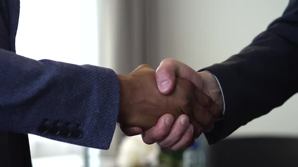 Handshake of Two Businessman - is the Completion of the Transaction