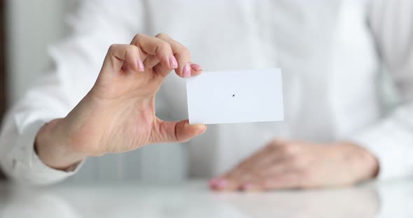 White Business Card in Hands of Business Person Closeup alt