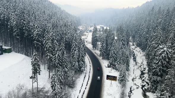 Aerial View of Snowed Winter Road in Carpathian Mountains alt