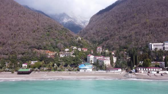 Mountains and sea. Lovely landscape. Blue sea water. Palm trees and sea. alt