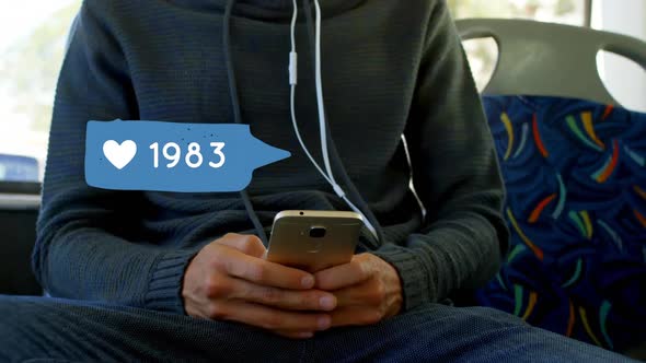 Man wearing sweatshirt texting alt