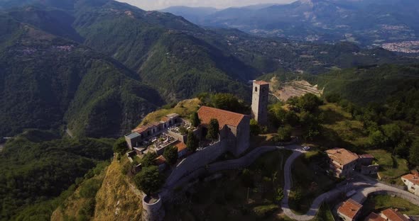 Medieval Tower Rocca Di Sassi And A Cemetery On Top Of The Apuan Alps In Tuscany, Italy