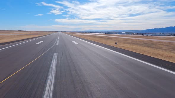 Airplane view taking off from the Colorado Springs Airport runway to the south alt