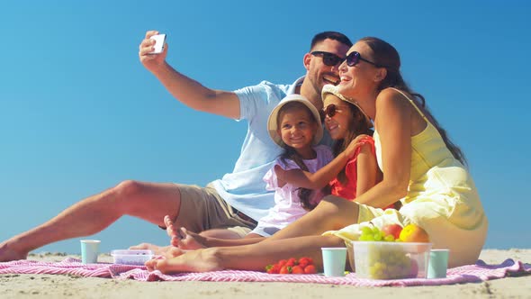 Happy Family Taking Selfie on Summer Beach alt