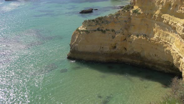 Tilt up of the rocky shore in Lagos alt