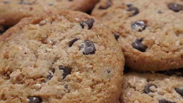 Biscuit cake with pieces of chocolate slow tilt 4K 2160p 30fps UHD video - Tilting on chocolate cook alt