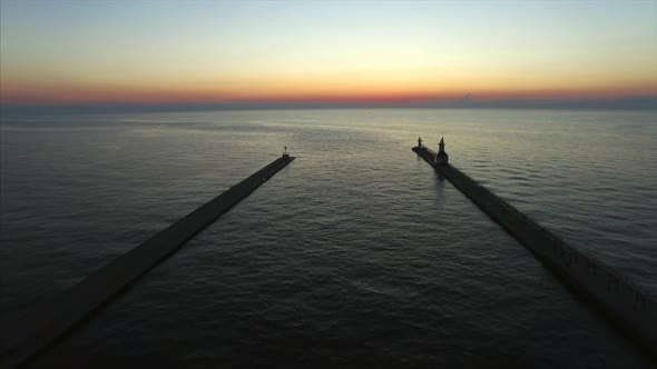 Drone sunset shot over Lake Michigan St. Joseph North and South Piers alt