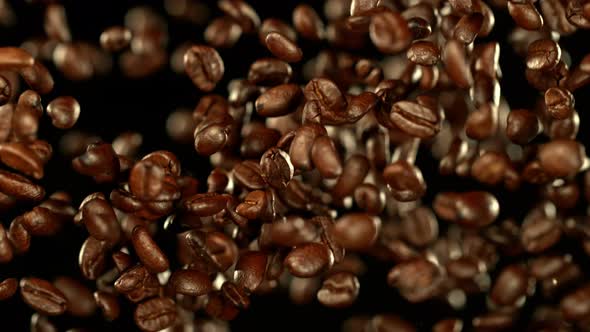 Super Slow Motion Shot of Exploding Premium Coffee Beans Towards the Camera at 1000Fps alt
