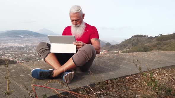 Senior Man with Laptop alt