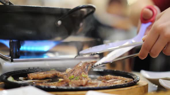 Cutlery in an Authentic Korean Restaurant- Tongs and Scissors alt