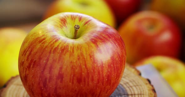 A ripe red-yellow apple rotates around its axis