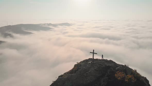 Aerial Rising View In Morning With Person Lookig Over Dramatic Cloudscape Panorama alt