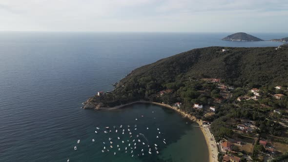 Aerial view of a small bay in Procchio along the coast on Elba Island, Italy. alt