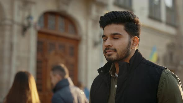 Handsome Guy in Casual Wear Walking on City Street alt