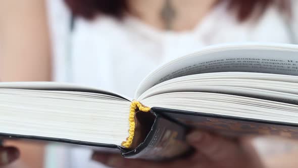 Beautiful Girl Reading A Book On The River