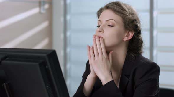 Tired Manager Working at a Computer alt