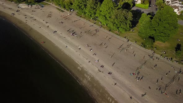 People Sunbathing On A Sunny Summer Day On Reopened Popular Kitsilano Beach In Vancouver, Lower Main alt