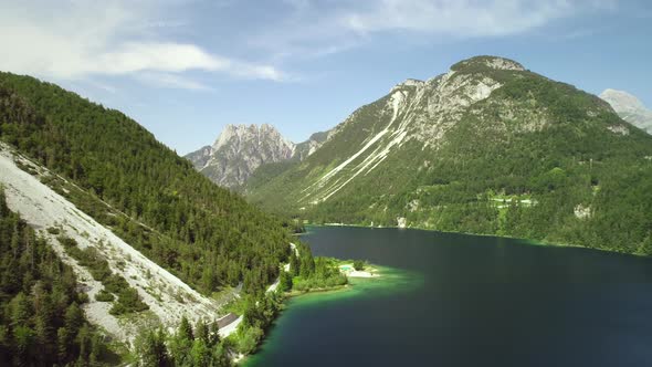 Aerial view of lake with green water near the Cave del Predil, Itally. alt