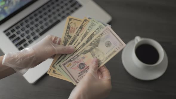 Female Hands with Dollar Banknotes alt