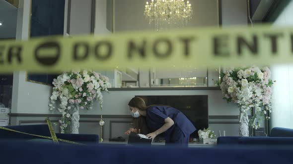 Attention to the sign, do not enter. raises a yellow warning sign prevent coronavirus  infection alt