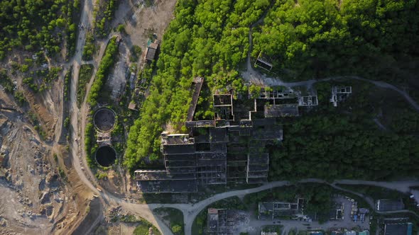 A Drone View Vertically Down of the Abandoned Building of the Mining Plant alt