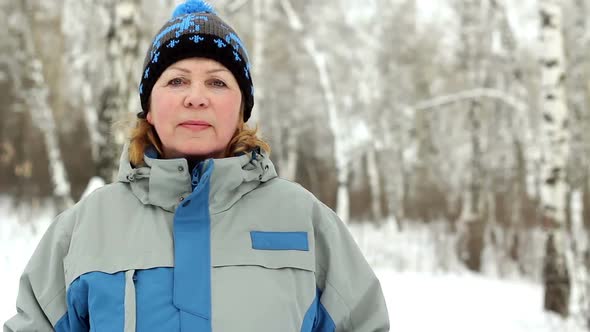 Portrait Of An Adult Woman In Sportswear On A Background Of A Winter Park.