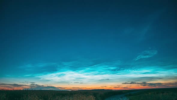 Time Lapse Night Starry Sky With Glowing Stars Above Countryside Landscape With Country Road And alt