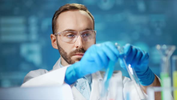 Medium Closeup Male Scientist Wearing Glasses and Gloves Working in Modern Laboratory alt