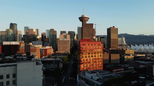 aerial drone footage of downtown Vancouver buildings, gas town, early sunrise, morning urban scraper alt
